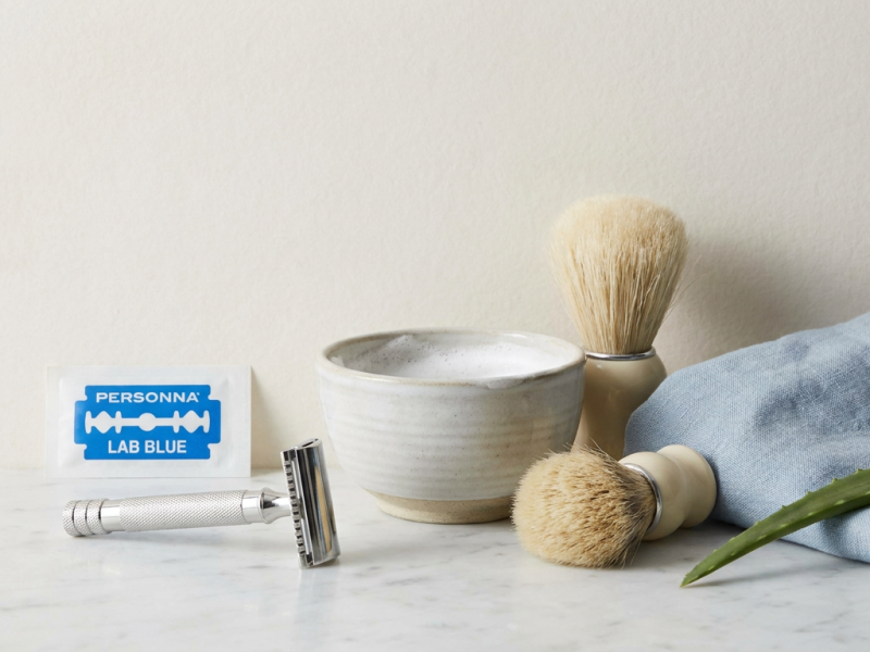 Personna Lab Blue double edge razor blade pack next to a chrome safety razor